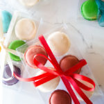 Macarons in a clear box with ribbon