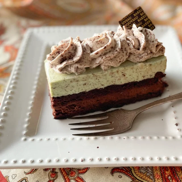 Say hello to the Grasshopper!

If the best chocolate-chip mint ice cream you’ve ever tasted went off to pastry school and came back as a fancy cake, this would be it.

Layers of chocolate biscuit cake, our silky 60% chocolate mousse, and peppermint Bavarois come together under a soft swirly fluff of white chocolate Chantilly. 

It’s refreshing, rich, and a little flirty.

Now in all 3 shops.