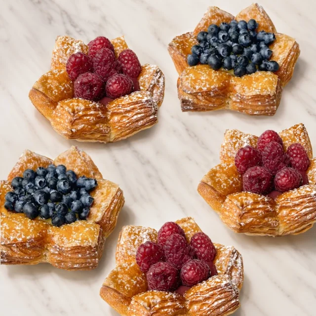 Most of our favorite pastries are governed by the seasons. 

The sun comes out, the fruit gets sweeter and the Flower Cup pastries return!

Blueberry Lemon Almond Flower Cups and Raspberry Almond Flower Cups are back! Filled with fresh berries, silky crémeux, almond cream, and tucked inside layers of buttery laminated pastry.

Available in all 3 shops and online.