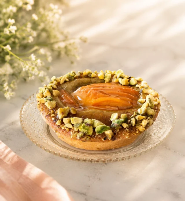 A summer favorite has returned!

Our individual sized Apricot Pistachio Tart is back for the season, bringing together sweet, sun-ripened apricots, a rich pistachio-almond frangipane, house-made apricot jam, and a sprinkle of chopped pistachios for the perfect finish.

It’s a fan favorite for sure, and  everything we love about summer in one dessert!

Available online and at all 3 shops.
